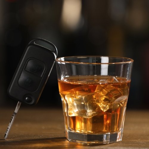 a glass of wine and car key